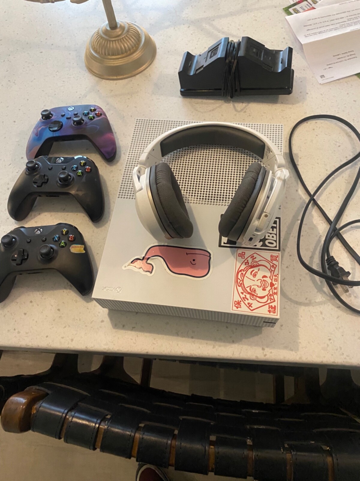 Xbox with custom controller and a Bluetooth headset with wireless charger