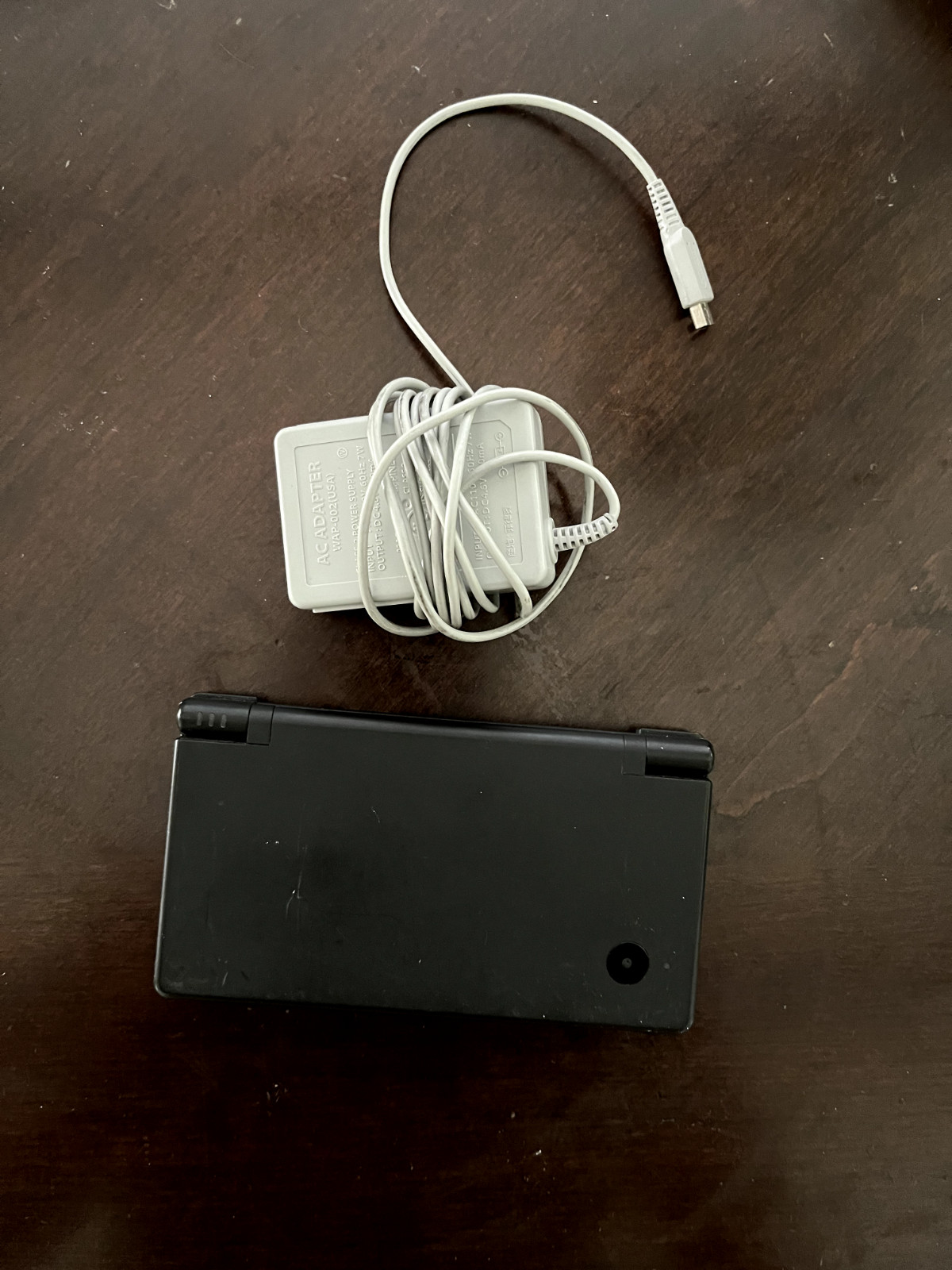 Nintendo DSi Black Edition, charger included, works great.