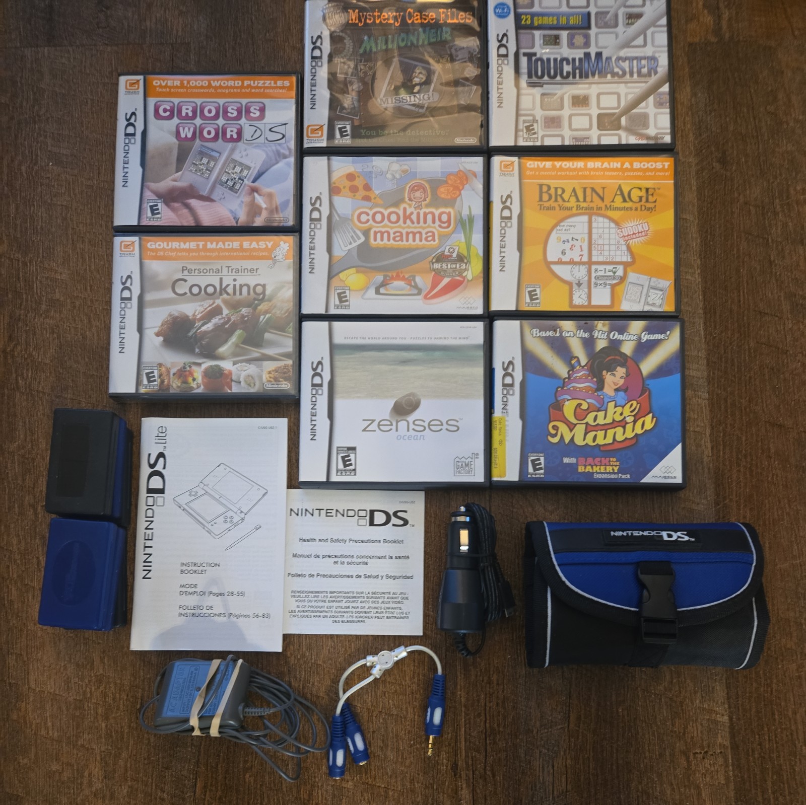 Nintendo DS Lite Bundle (Charger, 8 Games, extra stylus, & Nintendo case