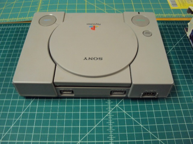 Sony Playstation 1 console bundle with 6 games .