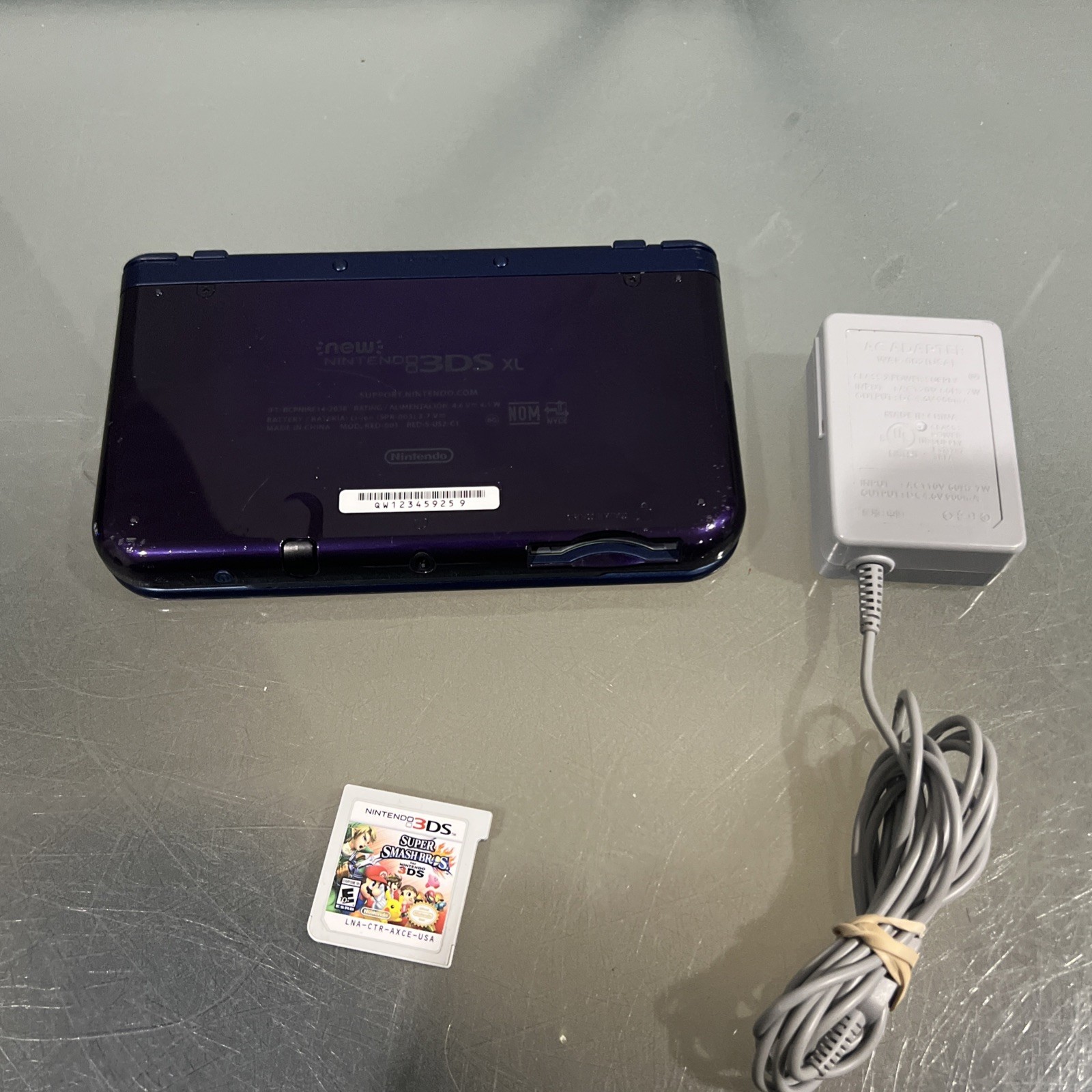 Nintendo 3DS XL Galaxy Edition Handheld Console System Purple & Super Smash Bros