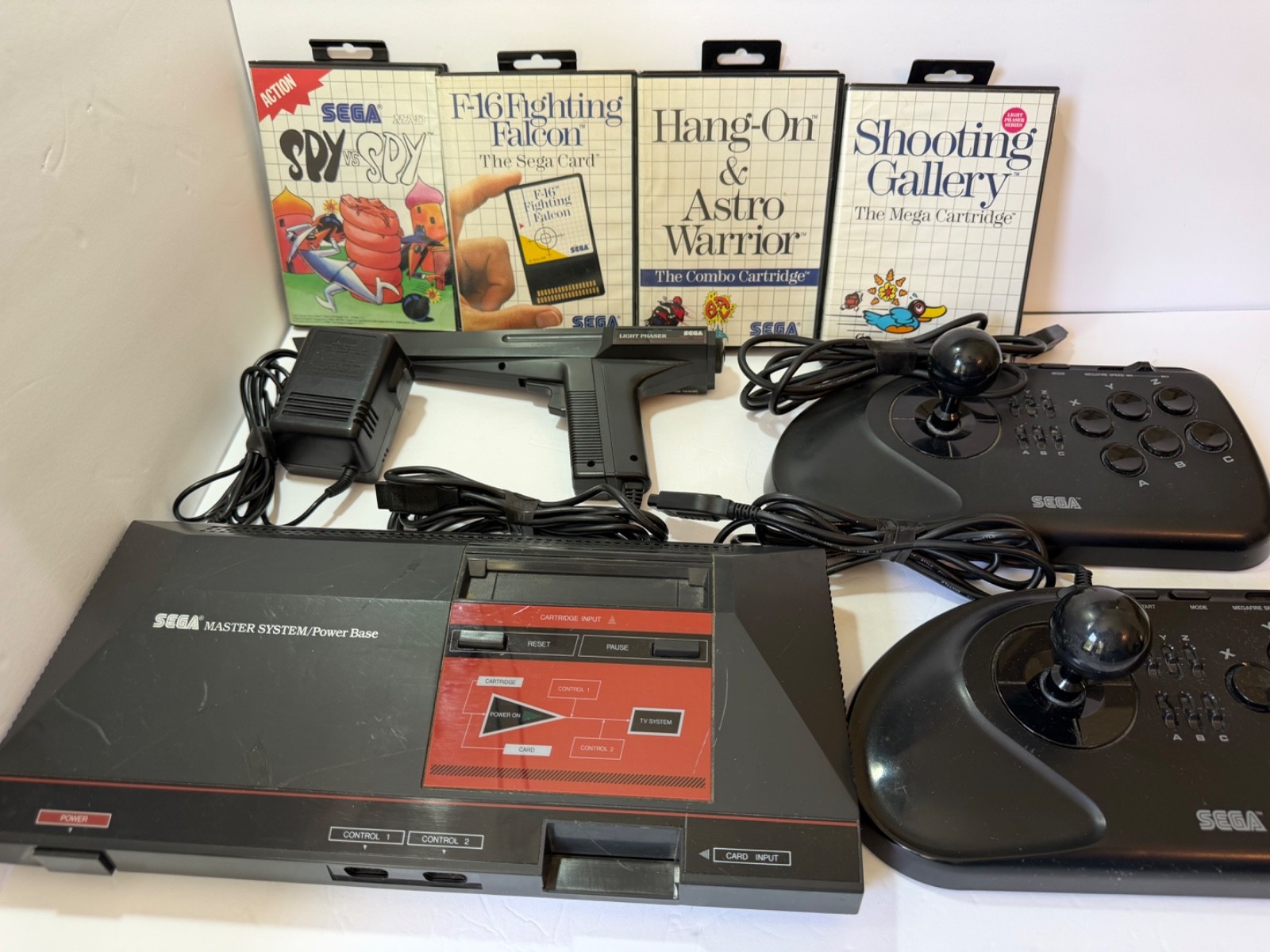 SEGA master system w/two 6 button controllers & phaser 4 games w/ box manual