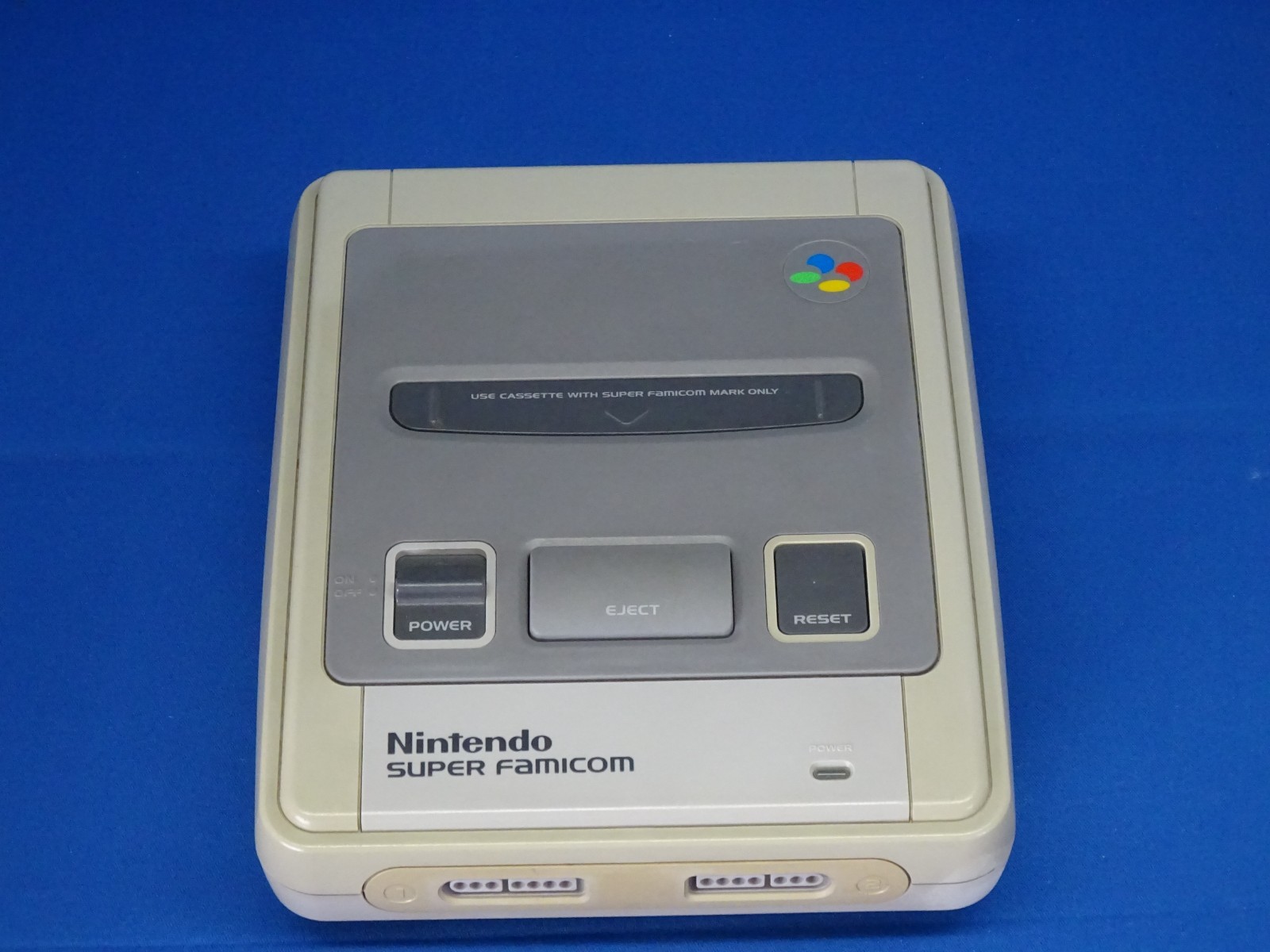 SNES case for Super Mario Kart, Super Mario World, and Super Picross.SNES shelf