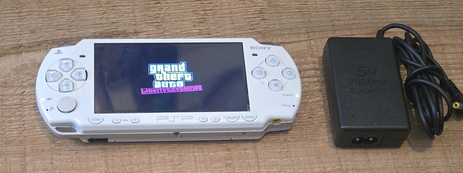 White Psp 2000 With Charger. The System Has Been Tested And Works Great.