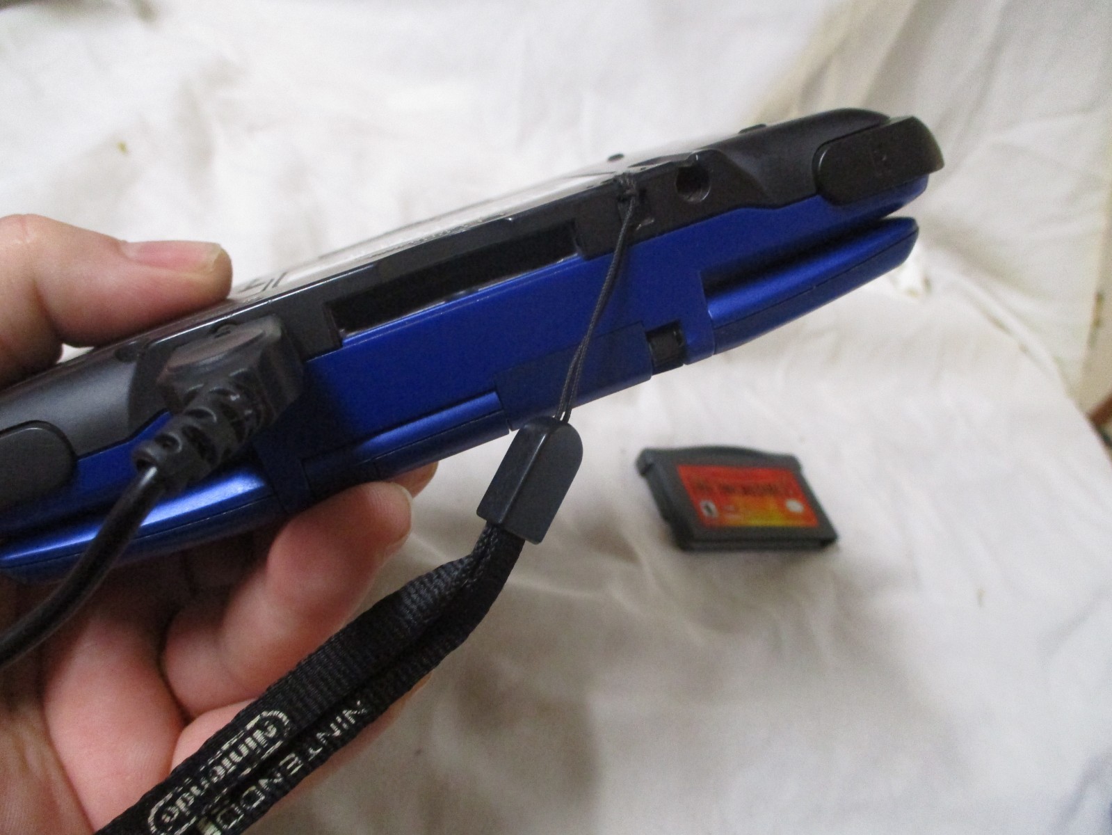 NINTENDO DS BLUE WITH GAMEBOY ADVANCE AND DS ABILITY 1 ARM BROKE