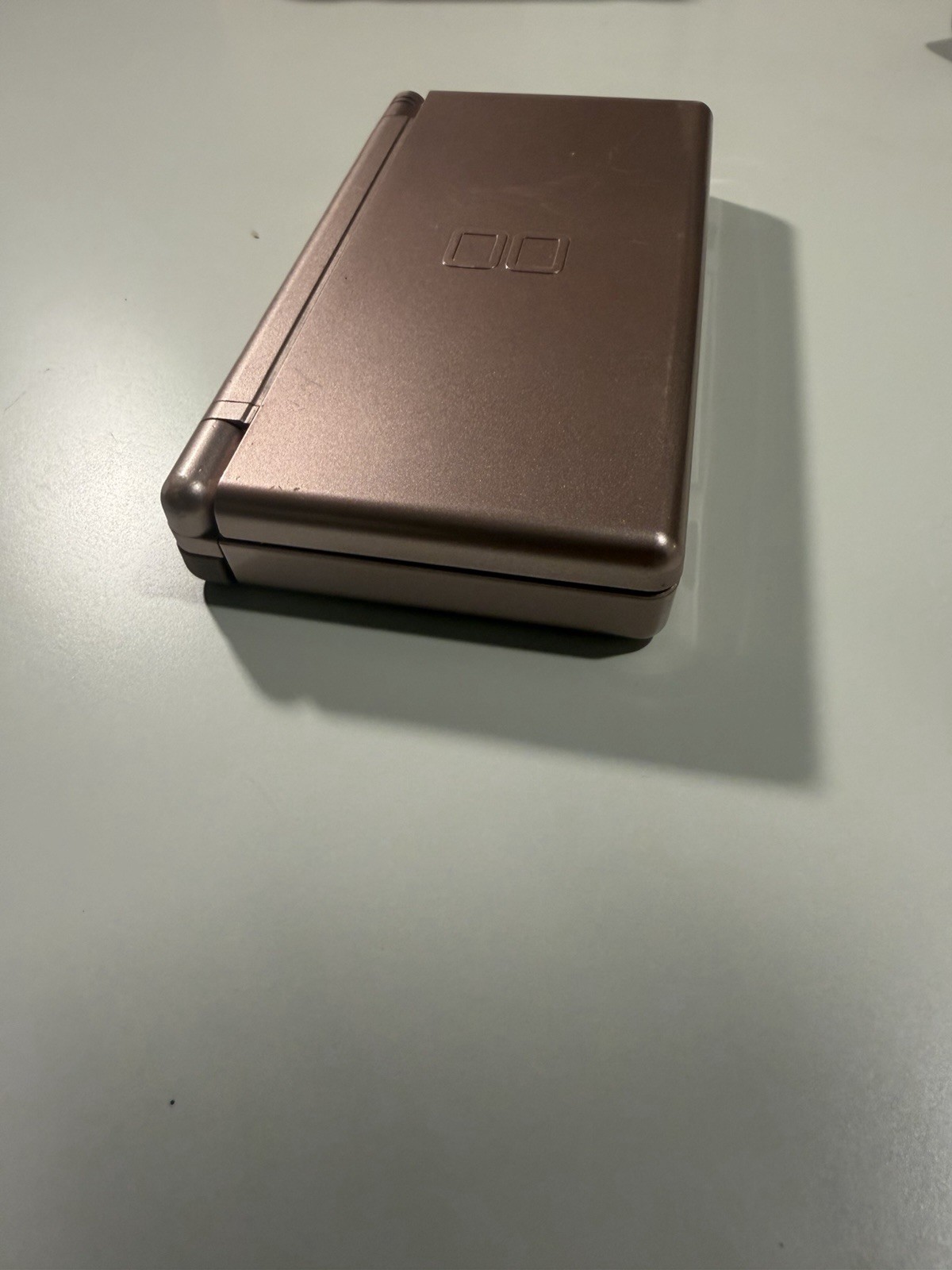 Nintendo DS Lite Metallic Rose System With Charger, Original Box, And 2 Cases