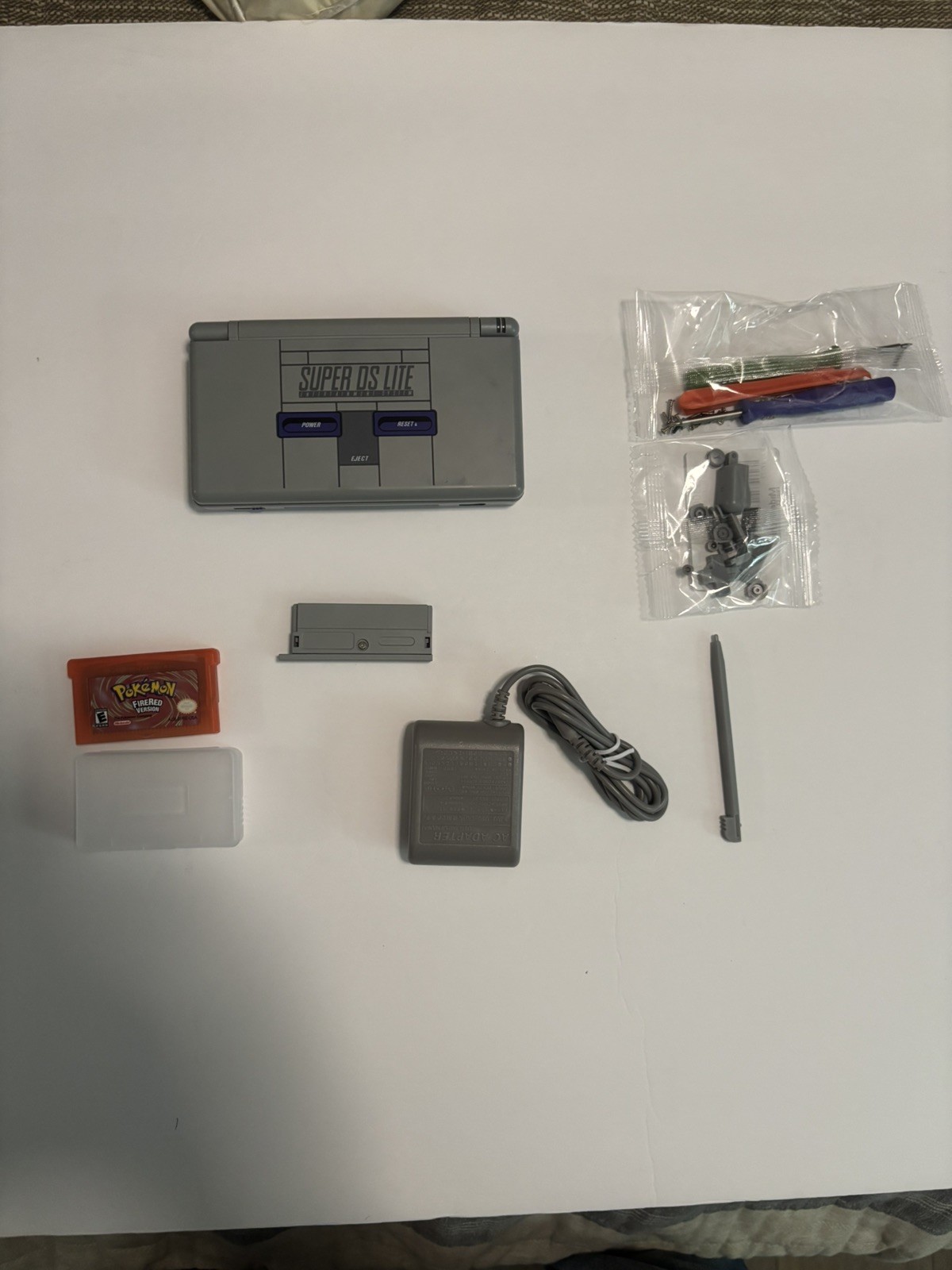 Nintendo ds lite SNES Bundle With Charger, firered and screwdriver/buttons