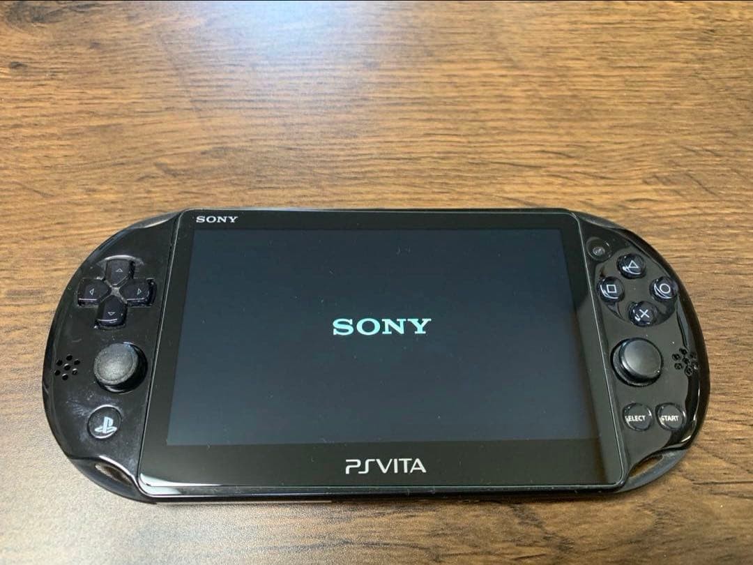 Good Condition PS Vita 2000 console charger 8GB memory card 2 games