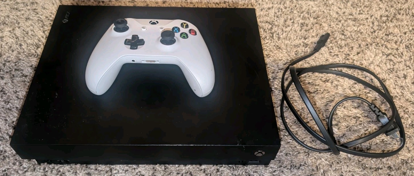 MICROSOFT Xbox ONE X 1787 with controller.