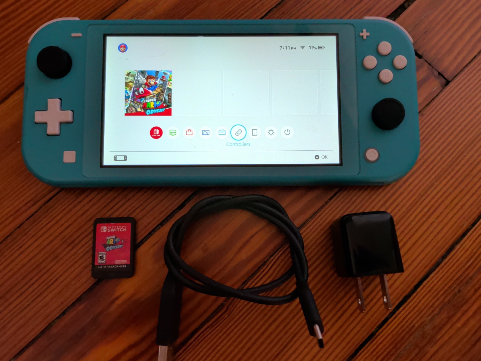 Nintendo Switch Lite Turquoise 32GB Console; Charger & Mario Odyssey Game – Fair