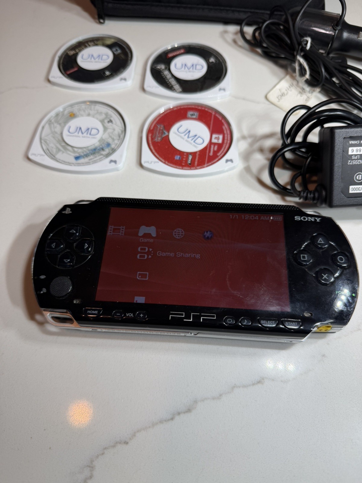 Sony PSP-1001 PlayStation Portable – Black w/ Games + Case + Cables