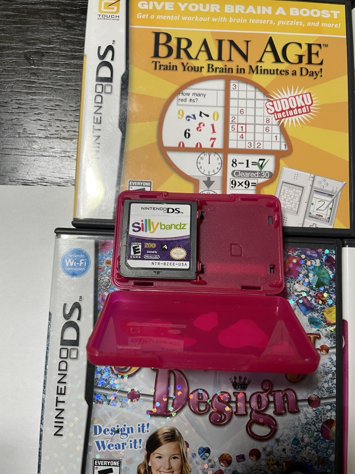 Nintendo DS Lite Handheld Console Lot 7 Games No Charger or Stylus Pink