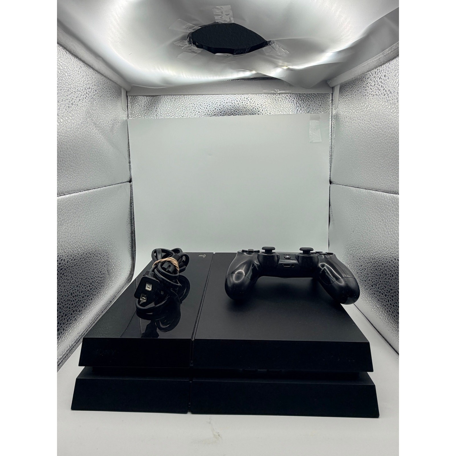 Original PlayStation four with controller and charger