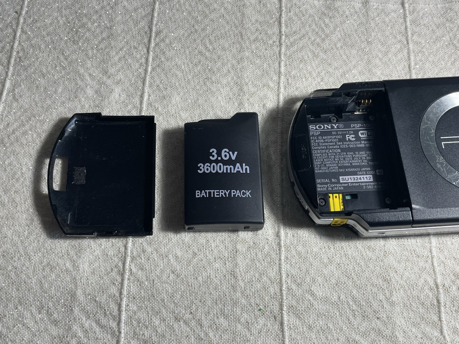 Sony PSP-1001 Black Console w/ 2GB Sony Storage Memory Card, 4 UMDs, Yes Charger