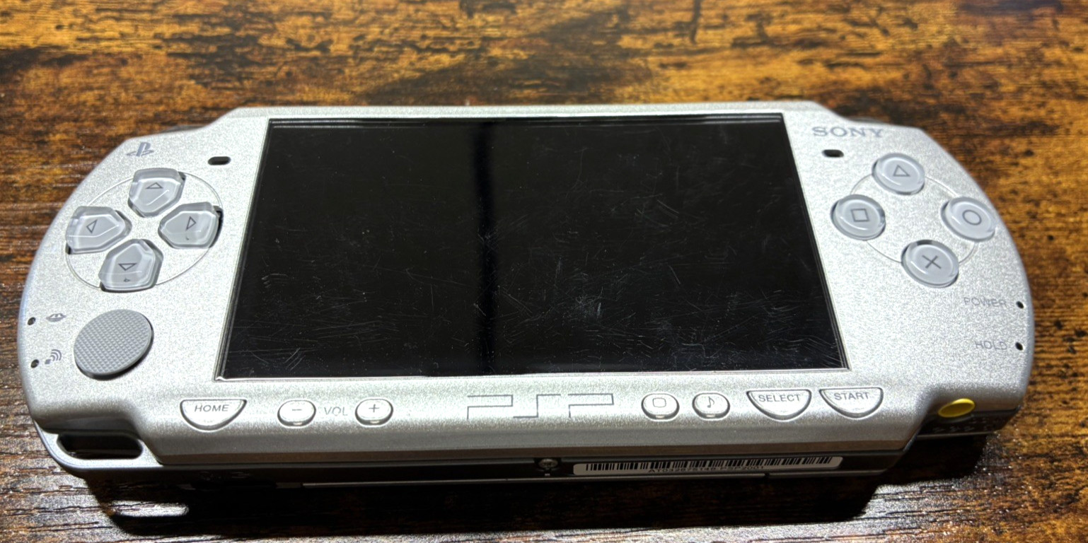 Sony PSP-2001 Silver Console NEW-Barely Used w/New Battery/Charger + 3 UMDs