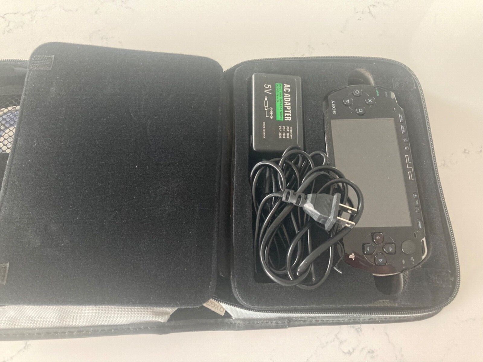 PSP complete with 10 games carrying case and power cord