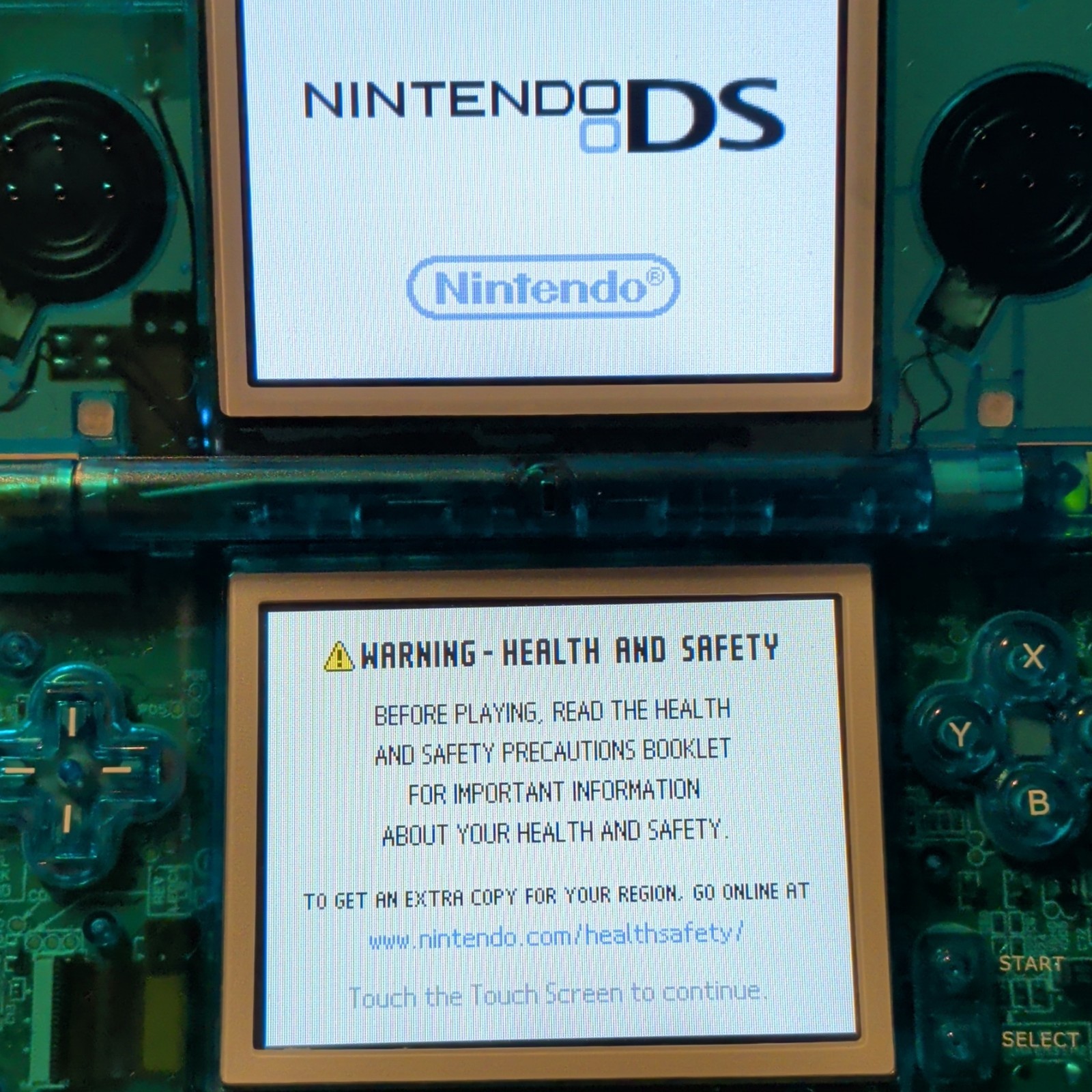 Nintendo DS Lite Transparent Blue Handheld Console with 500-in-1 Game Cartridge