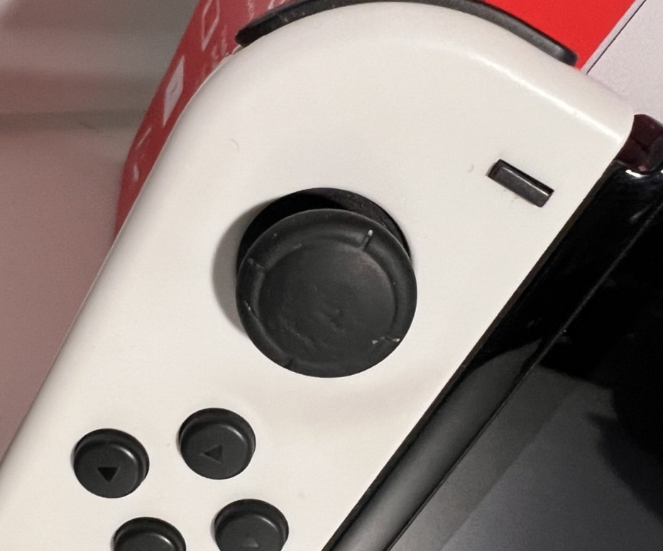 Nintendo Switch OLED Model HEG-001 Handheld Console – 64GB – White.