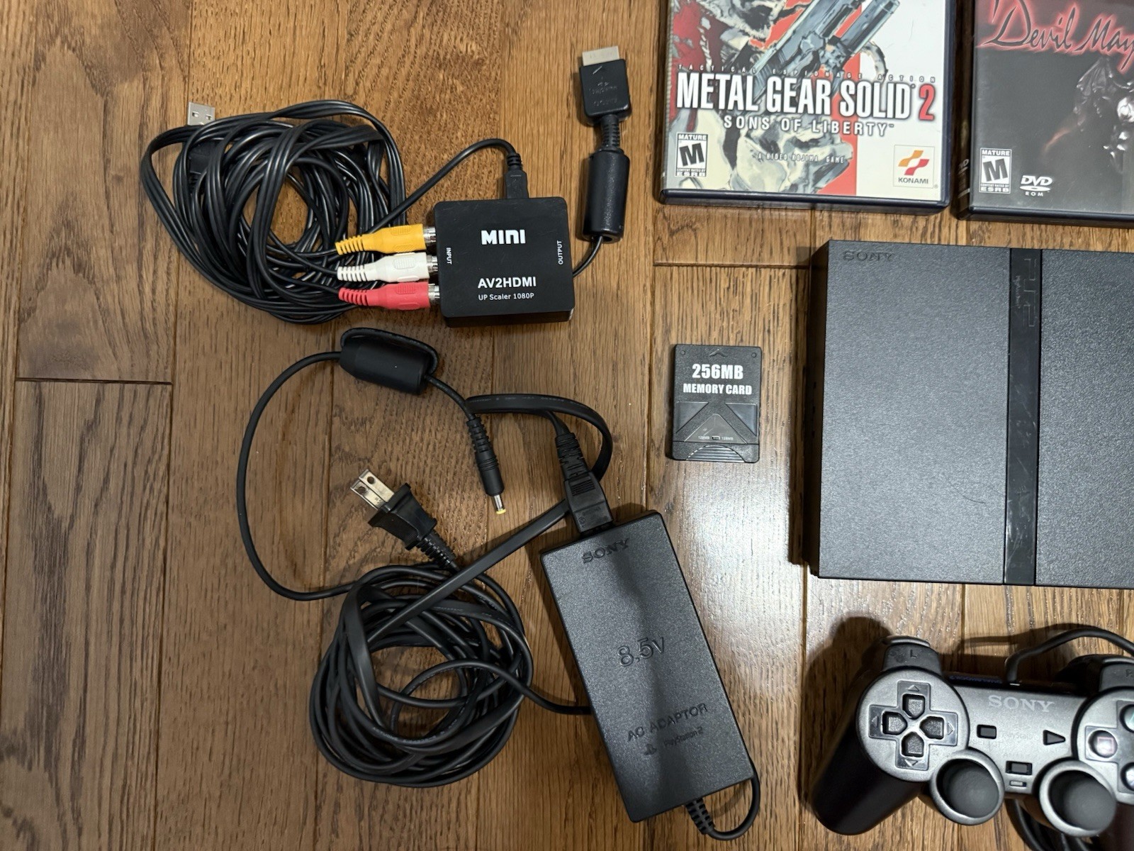 working sony ps2 console with cords, memory card, controller, 2 working games