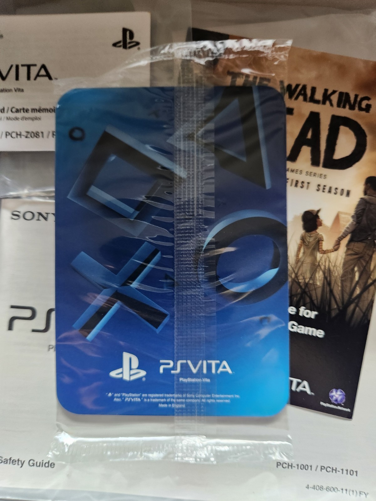 PlayStation PS Vita The Walking Dead Bundle w/64 GB Memory Card, Case, Two Games