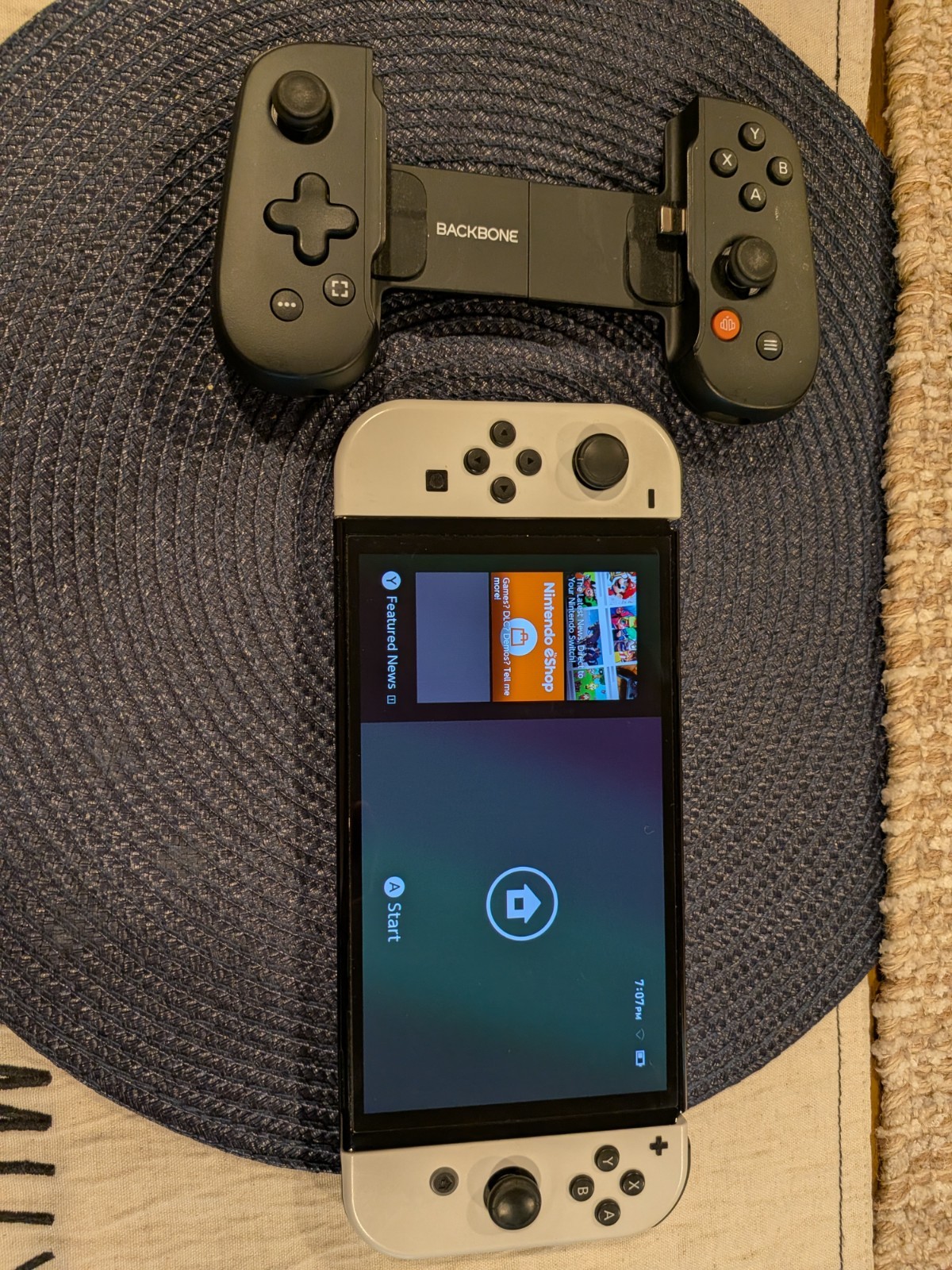 Nintendo Switch OLED- White with Backbone Handheld controller