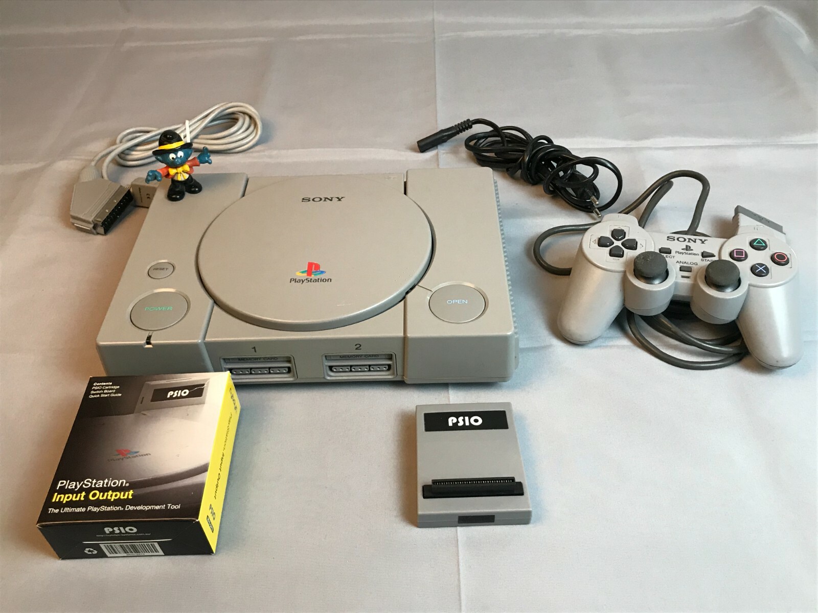 Sony PlayStation, SCPH-7500, PSIO Cybdyn, DualShock, RGB, SD 64GB, 110v, NTSC/J