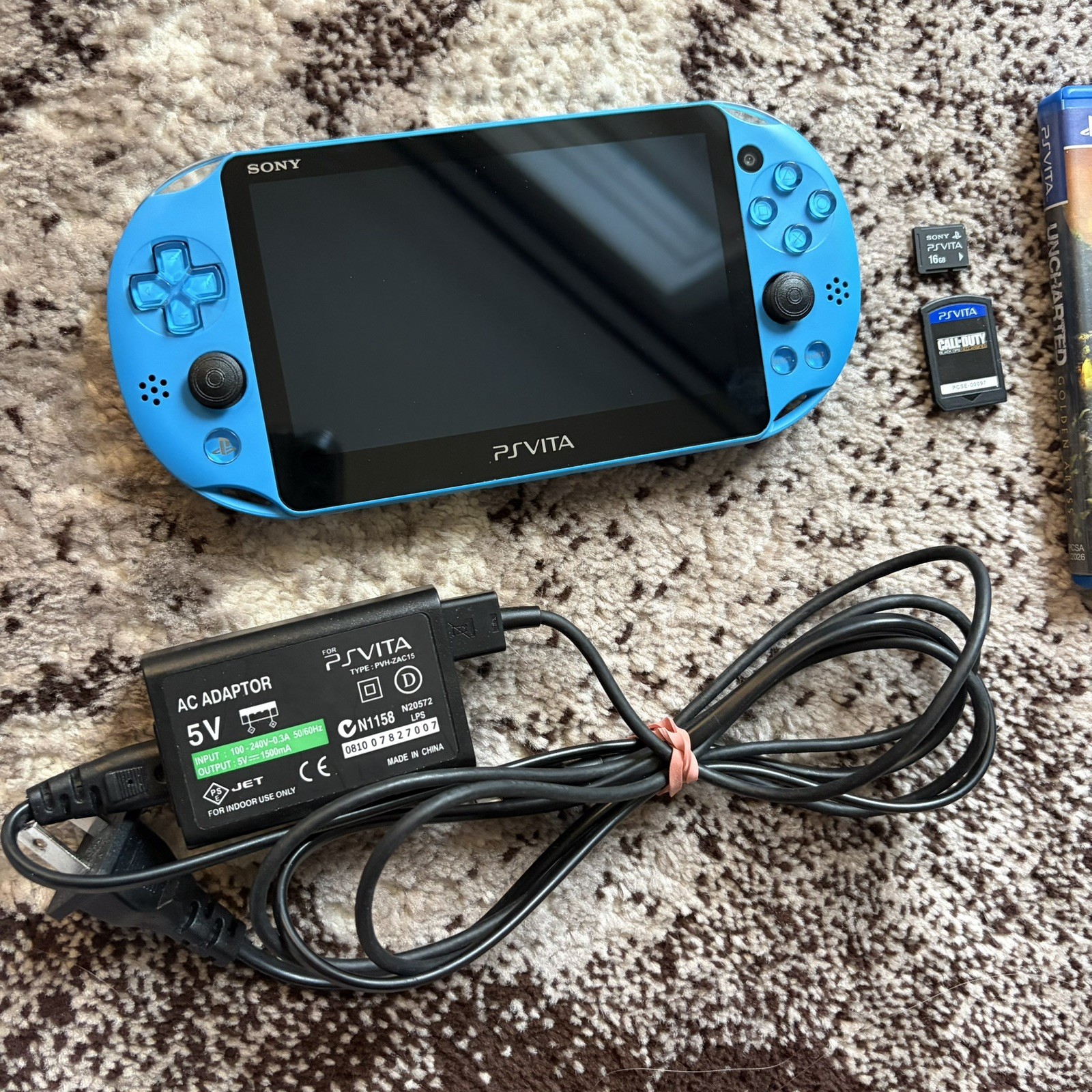 PS Vita Blue PCH-2000 ZA23 Slim Aqua Bundle, 2 Games + Charger 16GB Memory