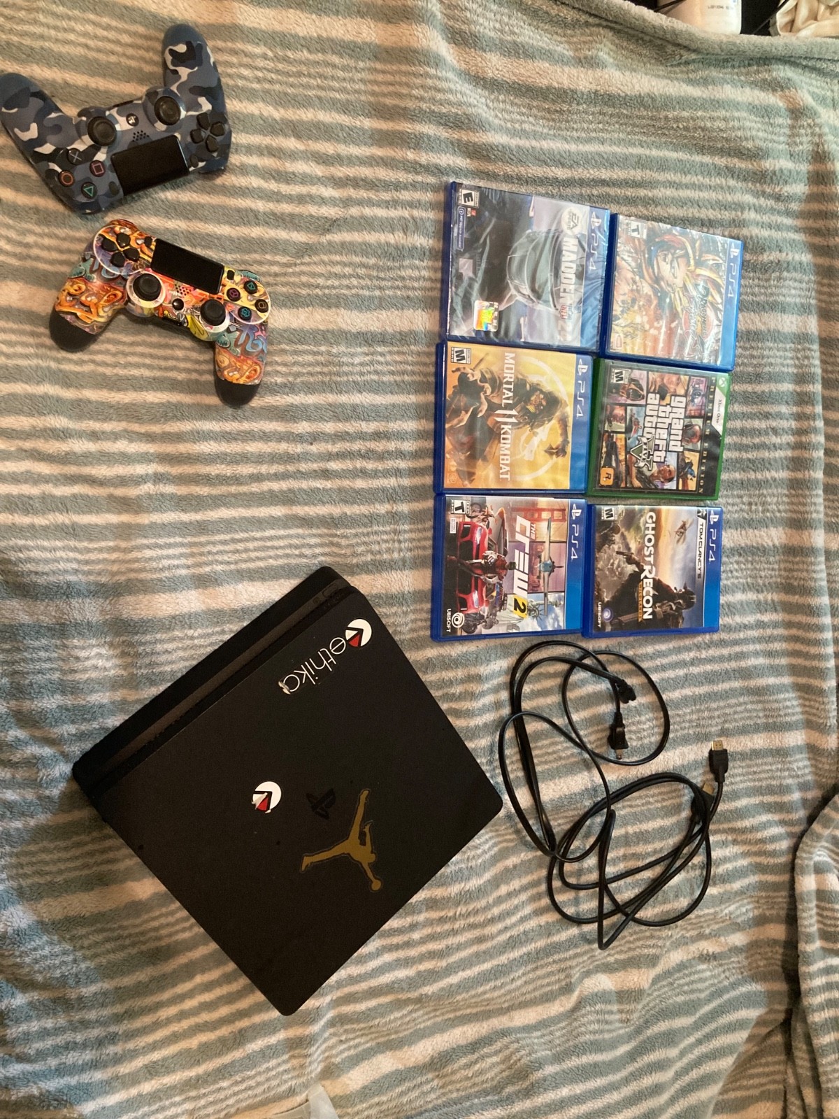 Sony PlayStation 4 Slim with two controllers and 6 games